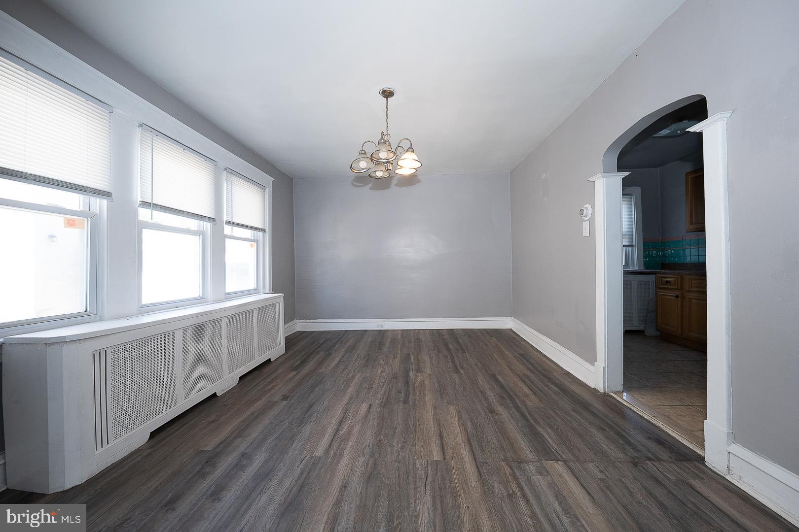 169 Overhill Road Upper Darby, PA 19082 - Photo 16 of 69 wooden floor in an empty room with a window