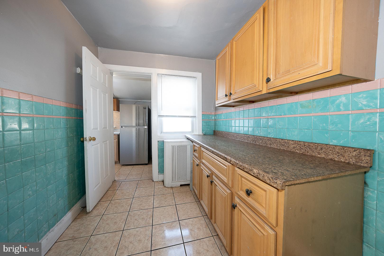 169 Overhill Road Upper Darby, PA 19082 - Photo 26 of 69 a kitchen with granite countertop a sink and a stove