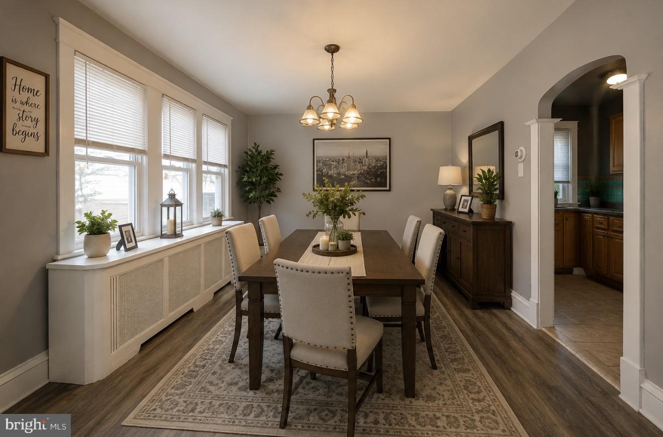 169 Overhill Road Upper Darby, PA 19082 - Photo 3 of 69 a dining room with wooden floor a chandelier a wooden table and chairs