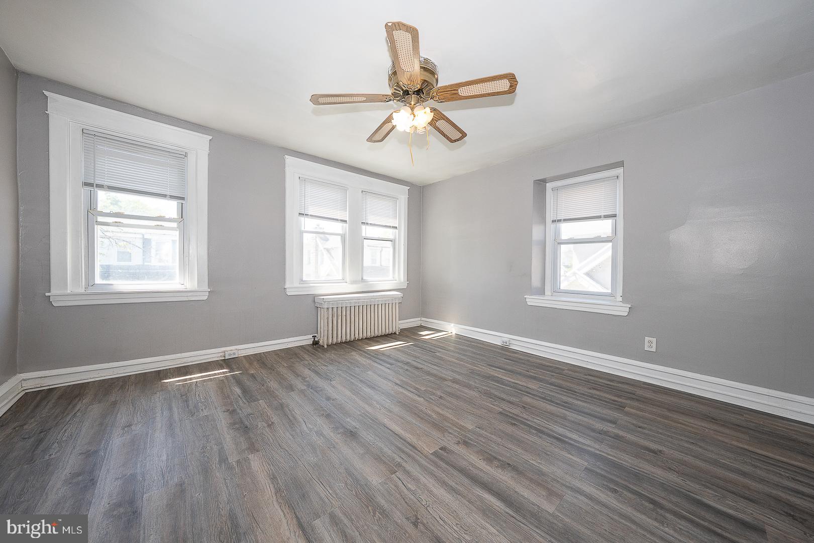 169 Overhill Road Upper Darby, PA 19082 - Photo 33 of 69 a view of an empty room with wooden floor and a window
