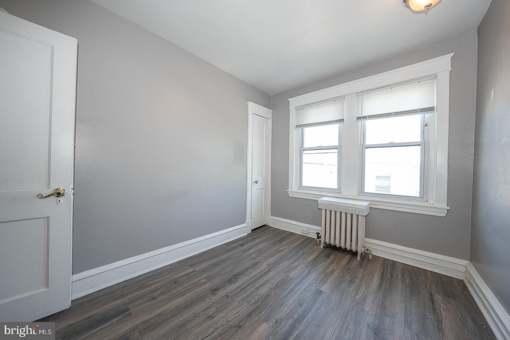 169 Overhill Road Upper Darby, PA 19082 - Photo 38 of 69 an empty room with wooden floor and windows