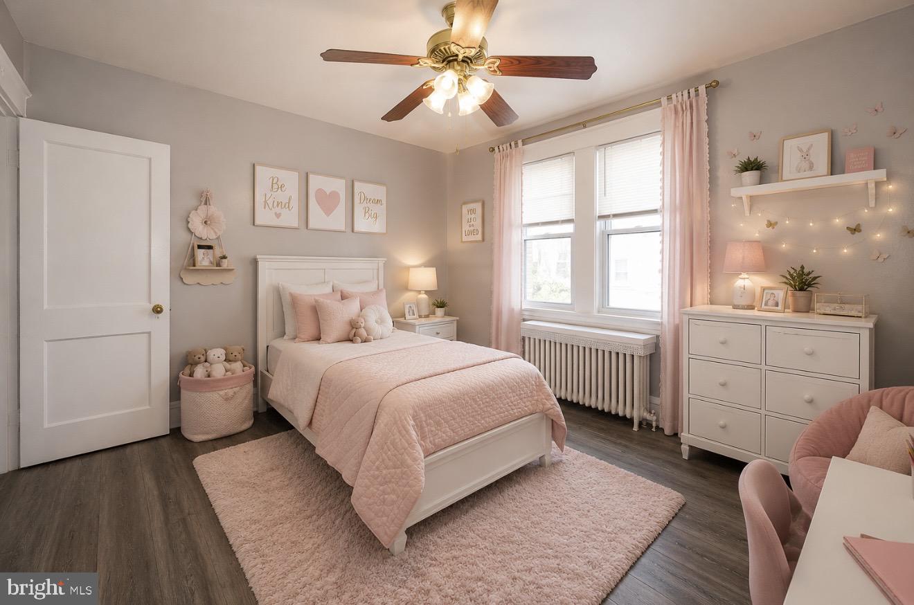 169 Overhill Road Upper Darby, PA 19082 - Photo 6 of 69 a bedroom with a bed and a chandelier
