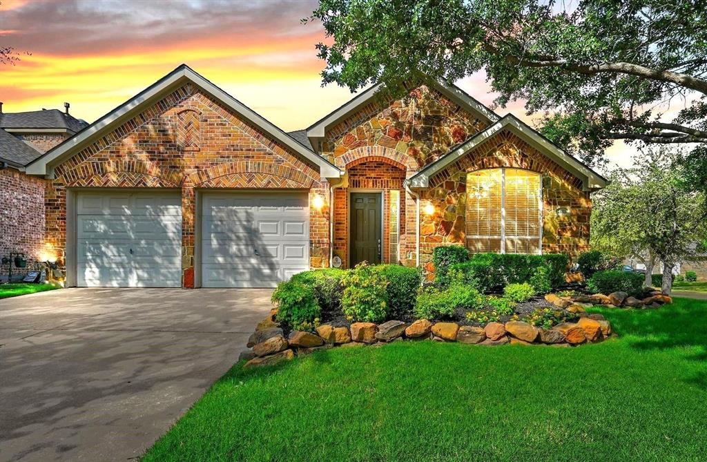 1181 Noble Avenue Road Lantana, TX 76226 - Photo 1 of 1 a front view of a house with a garden and plants