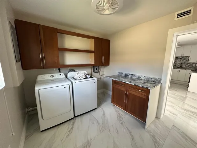 wooden floor in a hall with an entryway