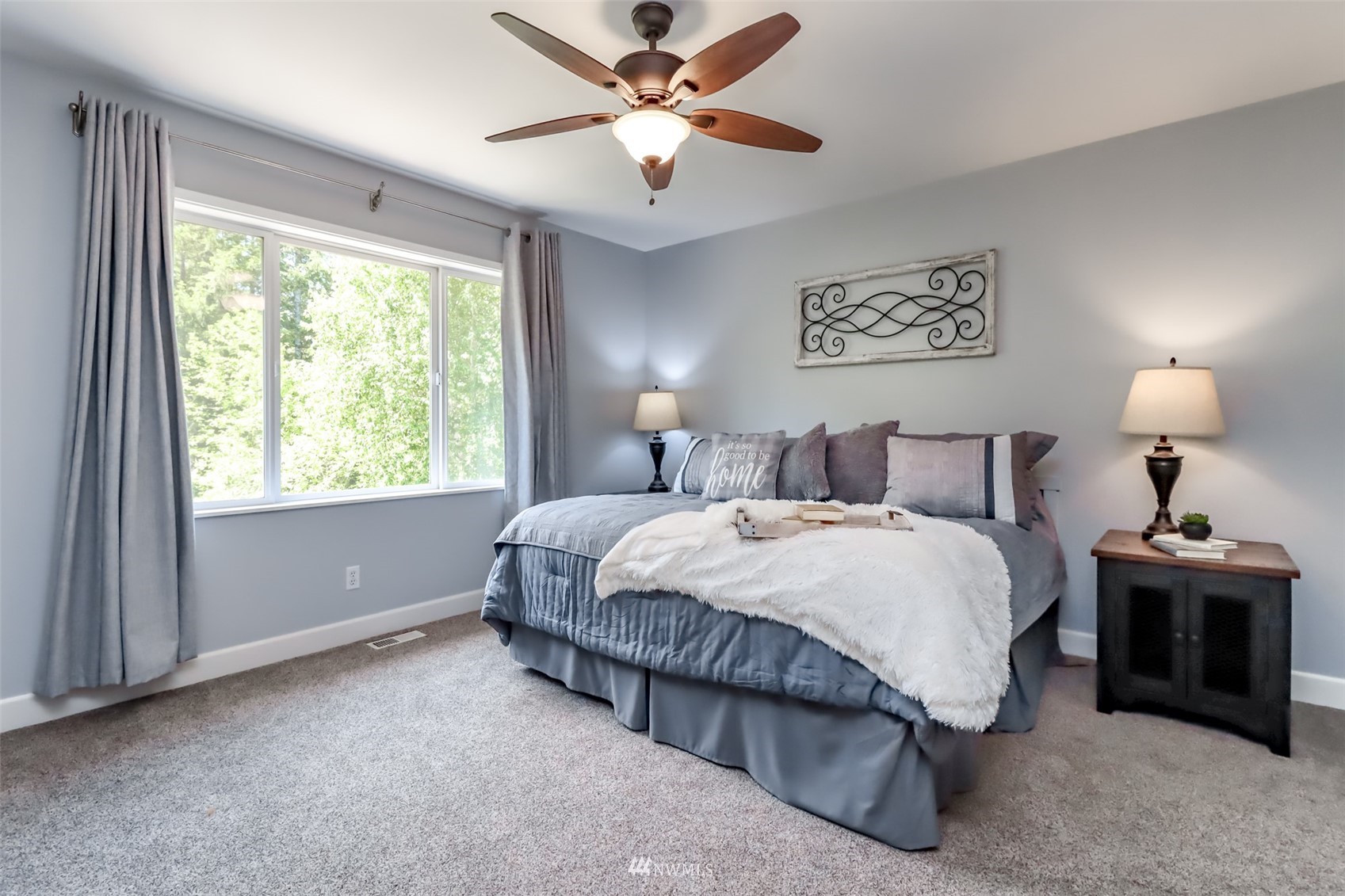 28035 Maple Ridge Way Southeast Maple Valley, WA 98038 - Photo 23 of 40 a bedroom with a bed and a window