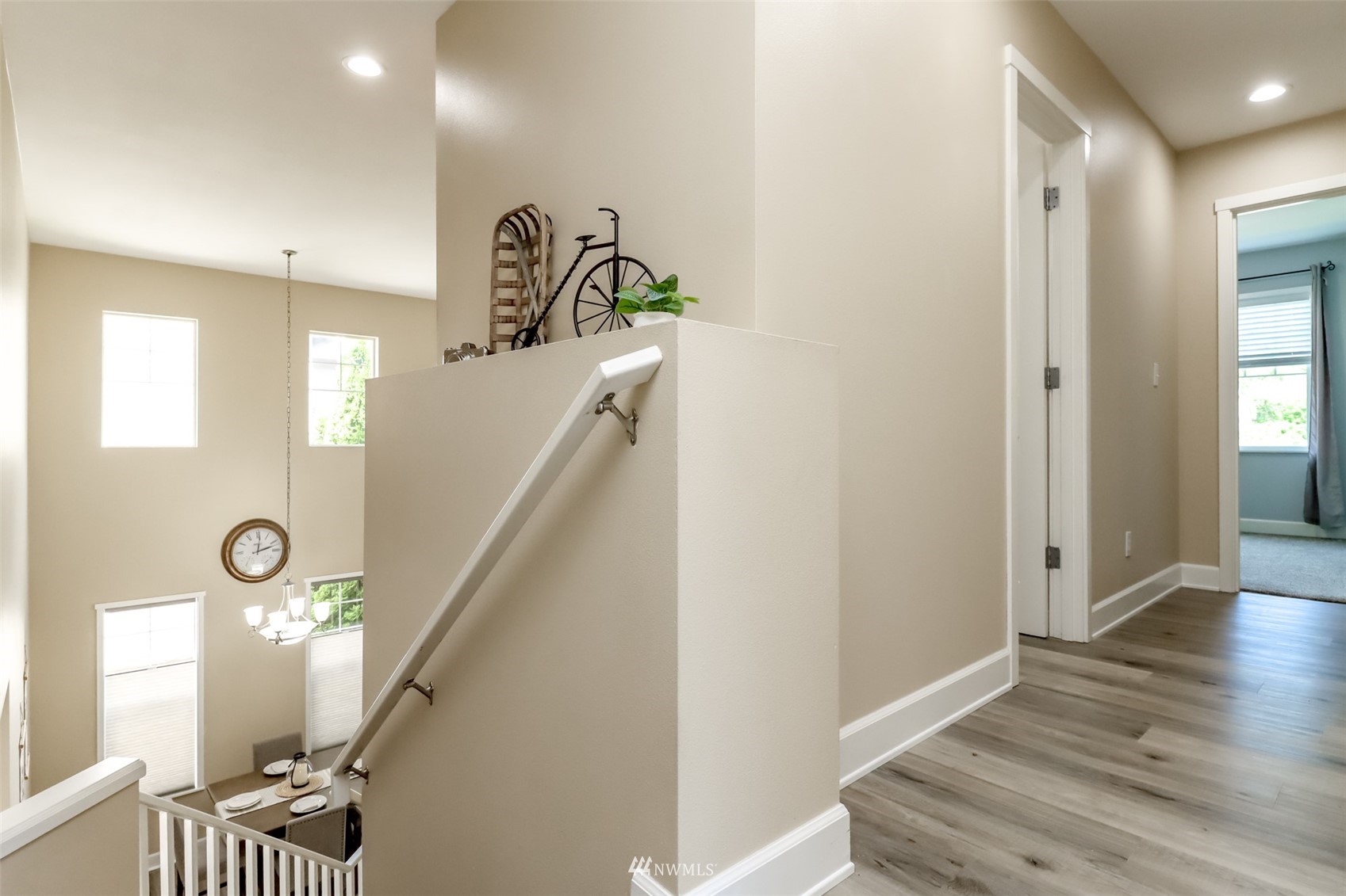 28035 Maple Ridge Way Southeast Maple Valley, WA 98038 - Photo 27 of 40 a view of a hallway with entryway wooden floor and front door