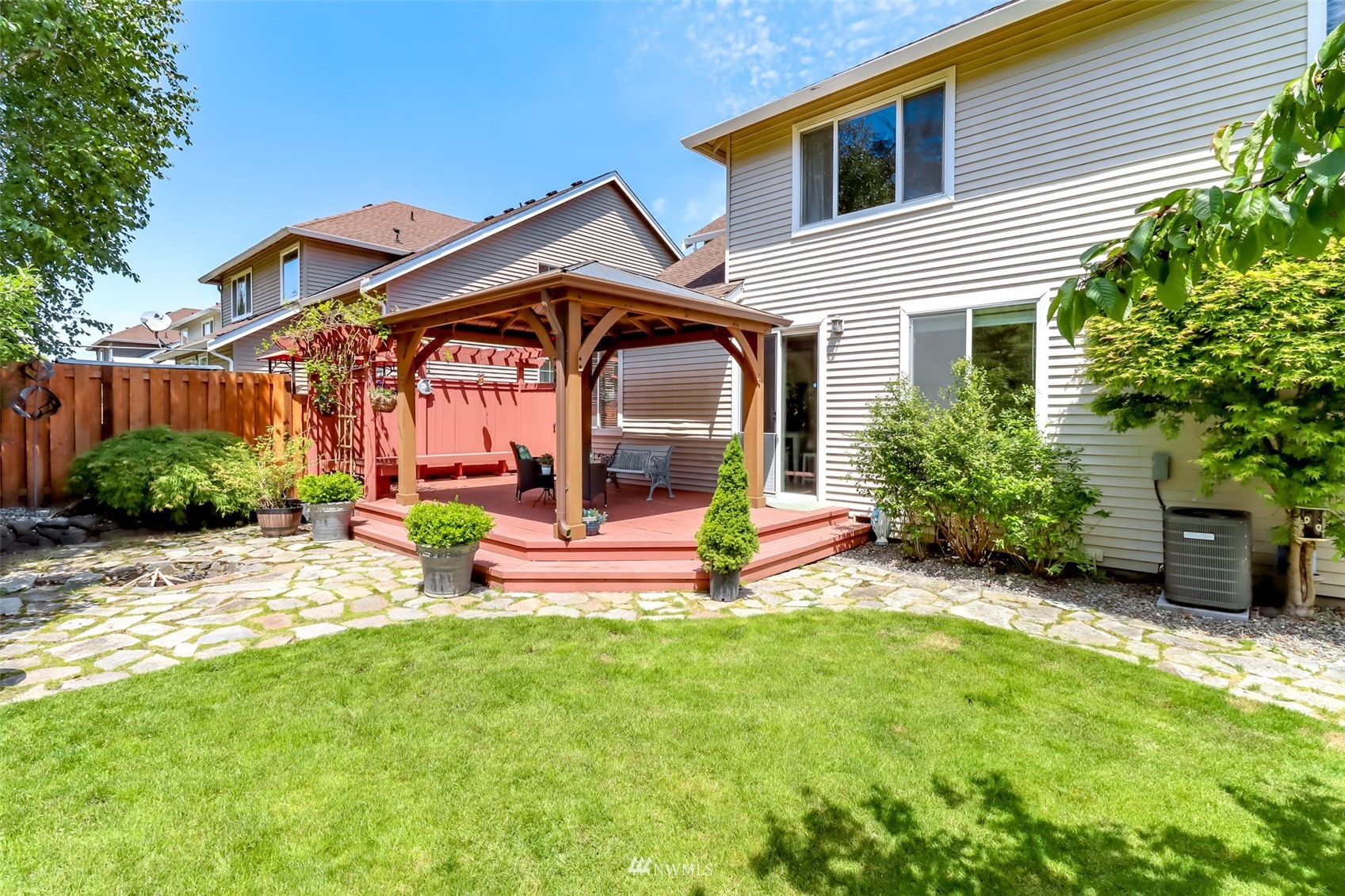 28035 Maple Ridge Way Southeast Maple Valley, WA 98038 - Photo 34 of 40 a view of a house with a small yard and plants