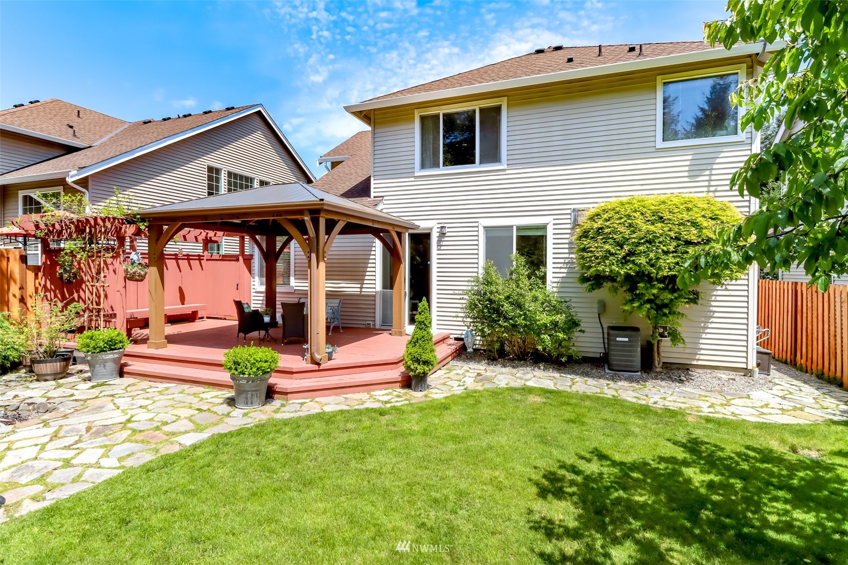 28035 Maple Ridge Way Southeast Maple Valley, WA 98038 - Photo 35 of 40 a view of a house with a yard porch and furniture