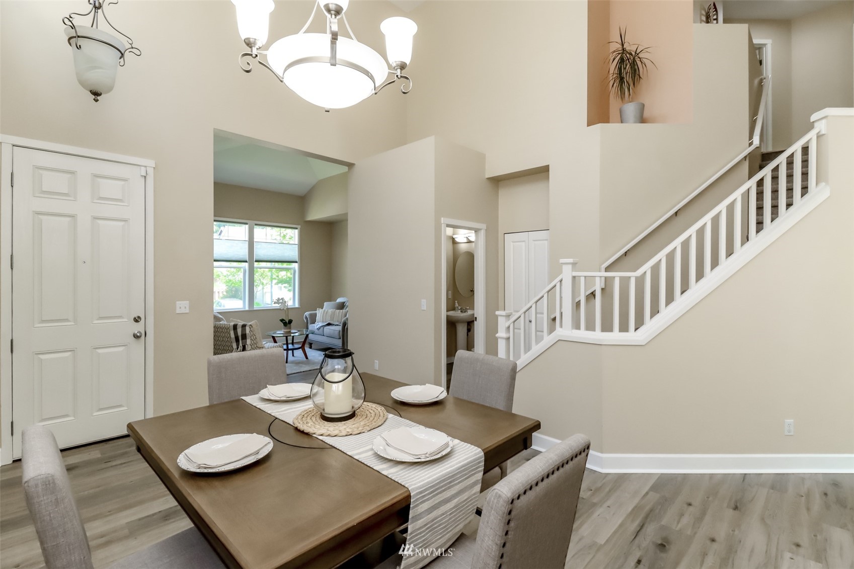 28035 Maple Ridge Way Southeast Maple Valley, WA 98038 - Photo 5 of 40 a view of a dining room with furniture and wooden floor