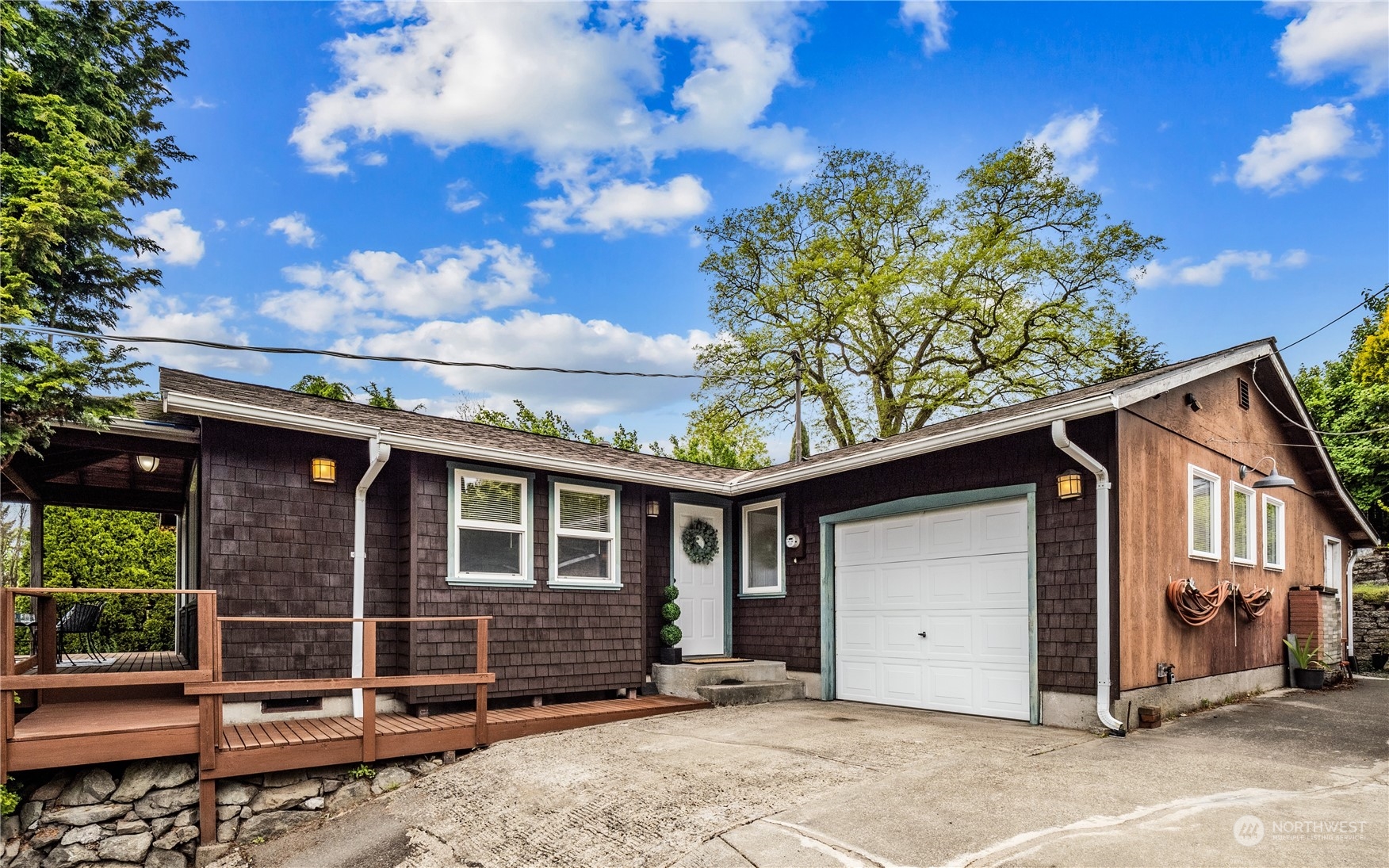 8414 14th Avenue Southwest Seattle, WA 98106 - Photo 1 of 20 a front view of a house with a garden