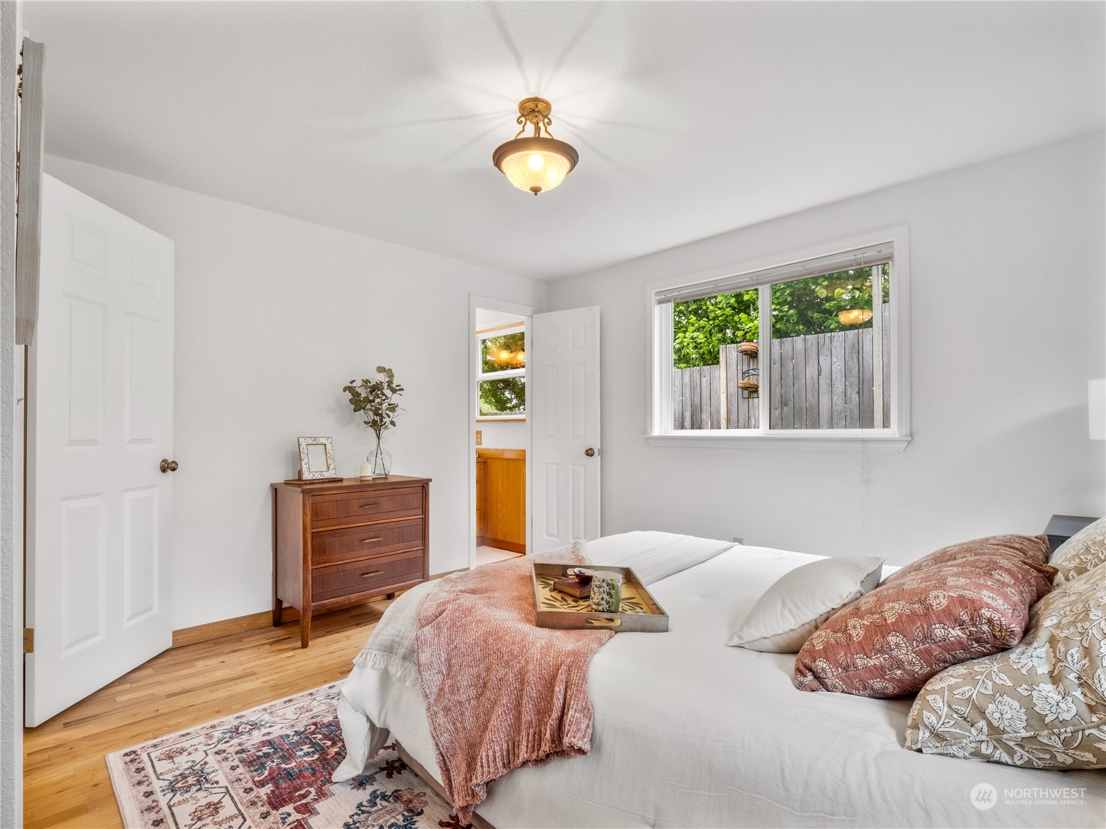 8414 14th Avenue Southwest Seattle, WA 98106 - Photo 12 of 20 a bedroom with a bed and a dresser