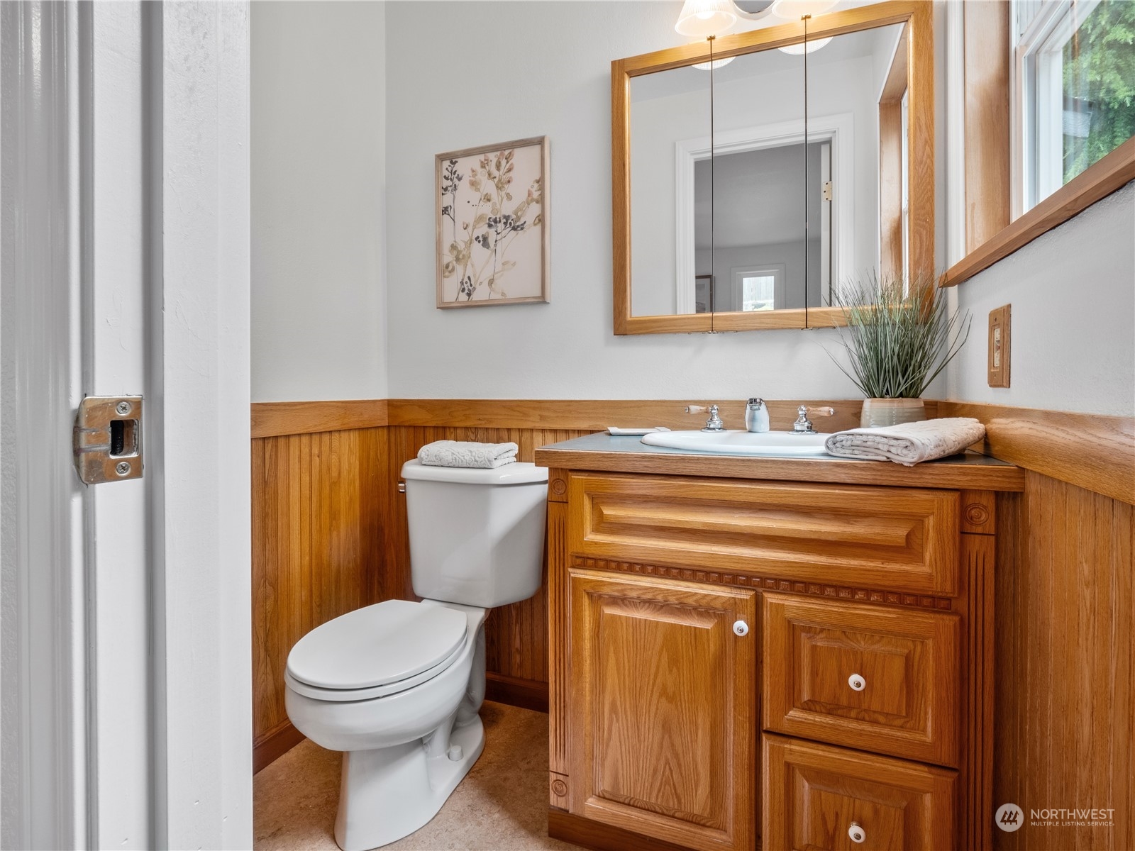 8414 14th Avenue Southwest Seattle, WA 98106 - Photo 13 of 20 a bathroom with a toilet a sink and mirror