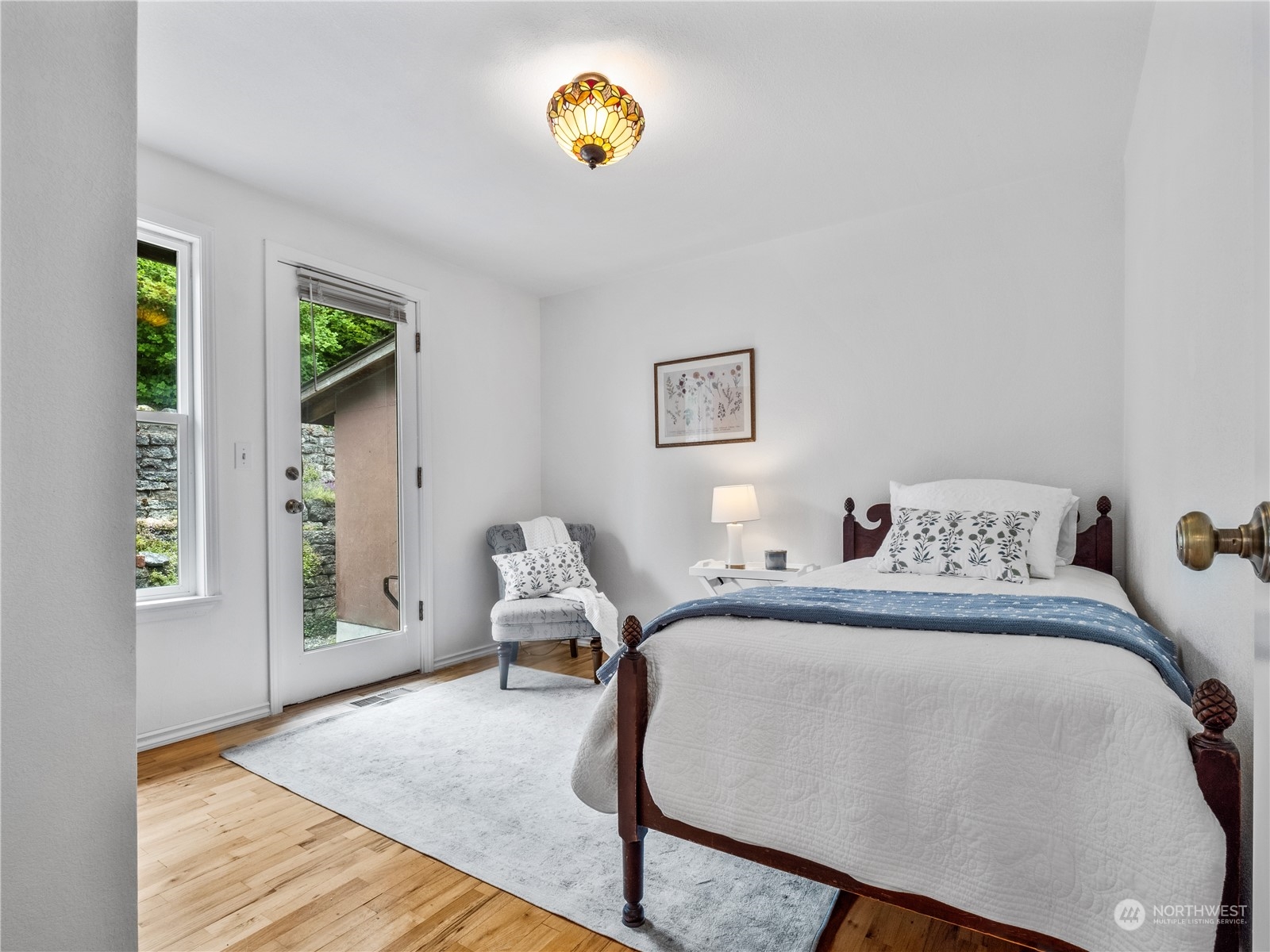 8414 14th Avenue Southwest Seattle, WA 98106 - Photo 14 of 20 a bedroom with a bed and a window