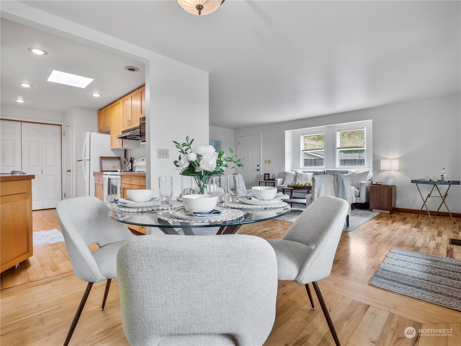 8414 14th Avenue Southwest Seattle, WA 98106 - Photo 5 of 20 a dining room with furniture a rug and wooden floor