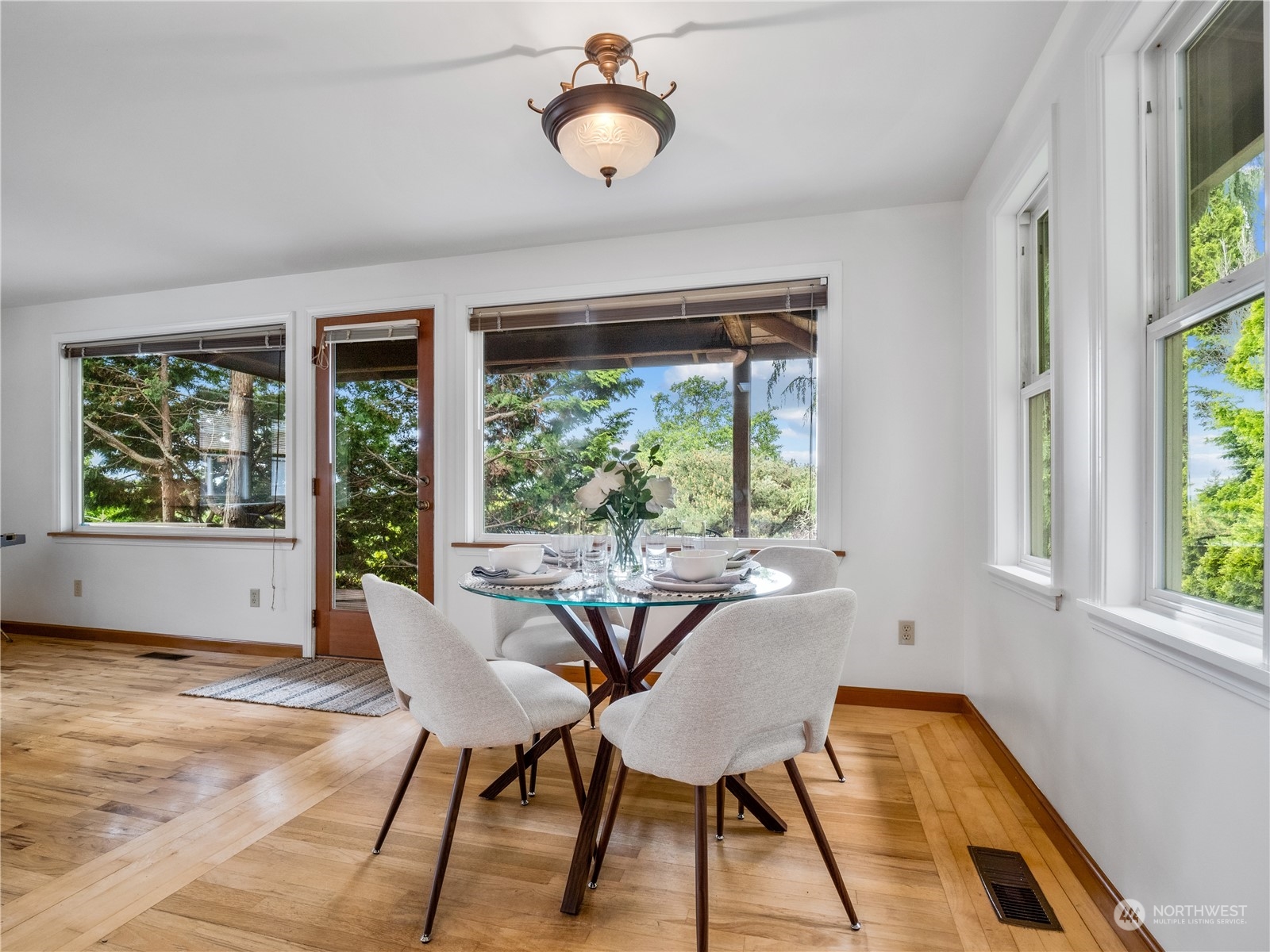 8414 14th Avenue Southwest Seattle, WA 98106 - Photo 6 of 20 a view of a dining room with furniture window and outside view
