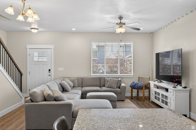 412 McClellan Court Provo, UT 84601 - Photo 5 of 20 Living room with light wood finished floors, suspended lighting, and a ceiling fan