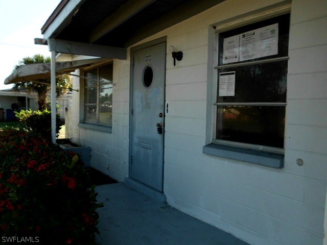 512 Wyoming Road Lehigh Acres, FL 33936 - Photo 2 of 17 a view of entryway front of house