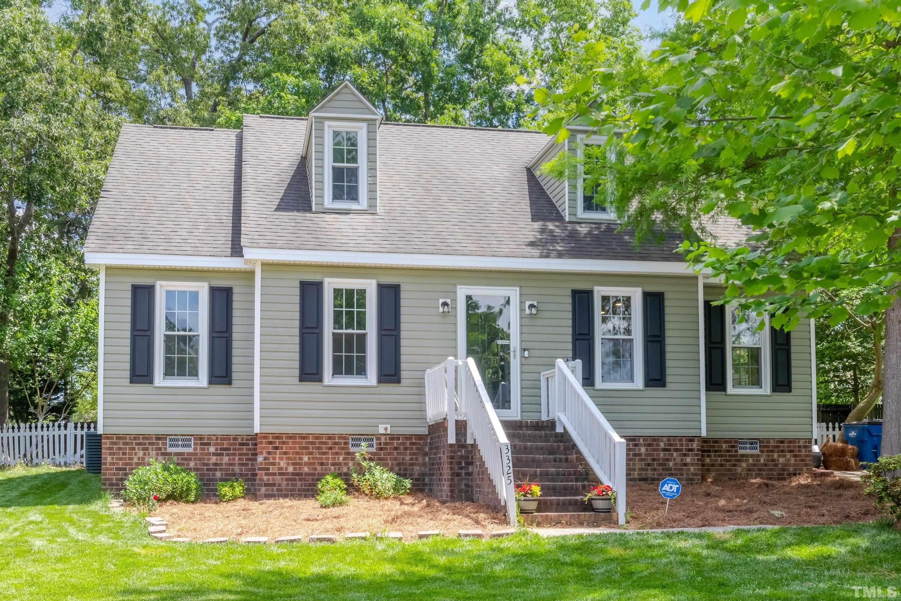 3325 Gatcombe Place Raleigh, NC 27604 - Photo 3 of 46 front view of a house with a yard