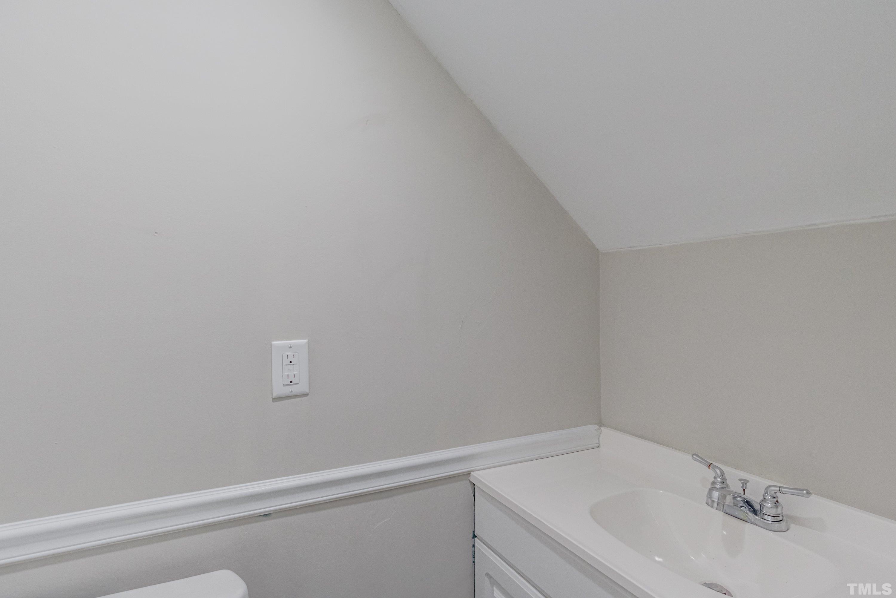3325 Gatcombe Place Raleigh, NC 27604 - Photo 10 of 46 a bathroom with a sink and cabinets