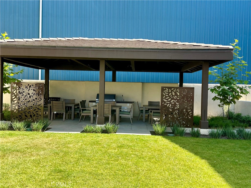 1752 West Sycamore Drive Compton, CA 90220 - Photo 6 of 21 a backyard of a house with table and chairs