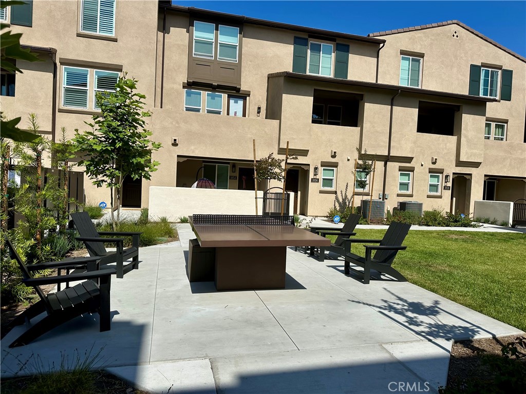 1752 West Sycamore Drive Compton, CA 90220 - Photo 8 of 21 a view of a patio with table and chairs and potted plants