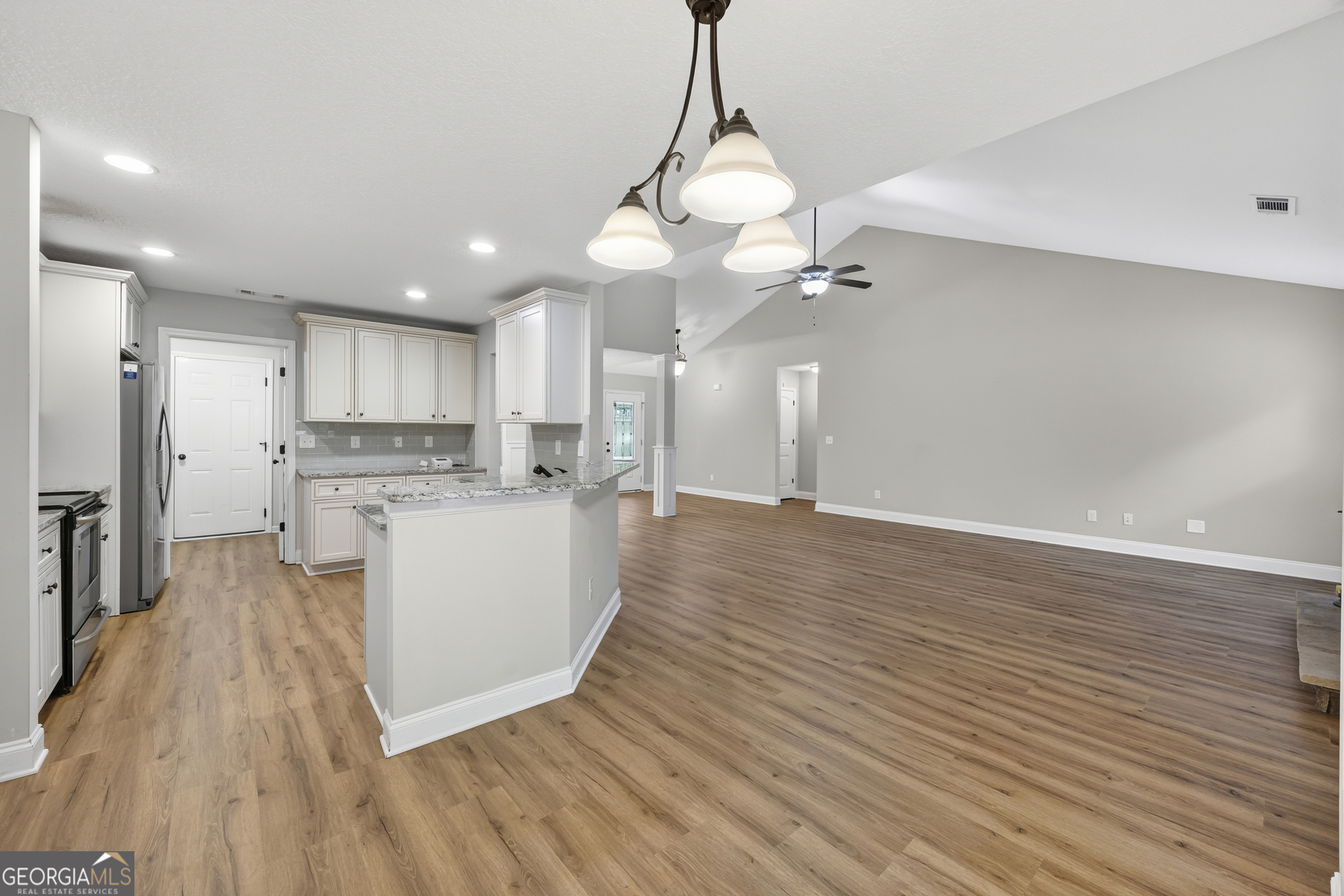 717 Oconee Lane Commerce, GA 30529 - Photo 26 of 57 a view of a kitchen with wooden floor