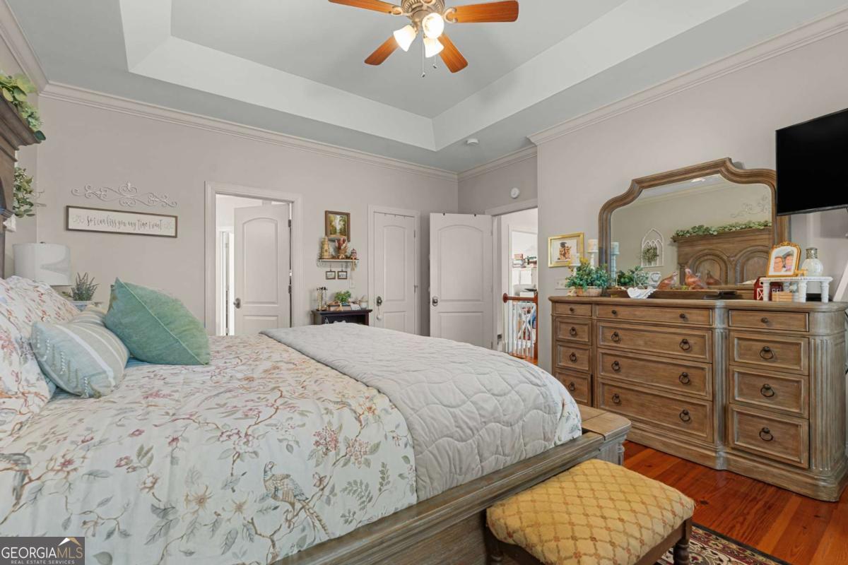 201 Walthour Drive Rincon, GA 31326 - Photo 18 of 29 a bedroom with a bed and a chandelier