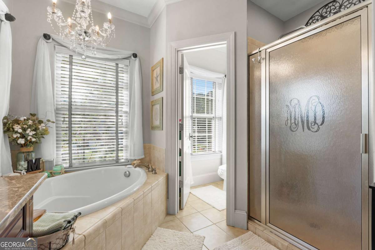 201 Walthour Drive Rincon, GA 31326 - Photo 20 of 29 a bathroom with a bathtub a shower and a sink