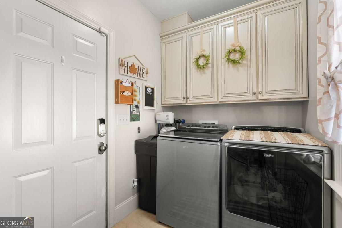 201 Walthour Drive Rincon, GA 31326 - Photo 22 of 29 a kitchen with stainless steel appliances granite countertop a stove and a refrigerator