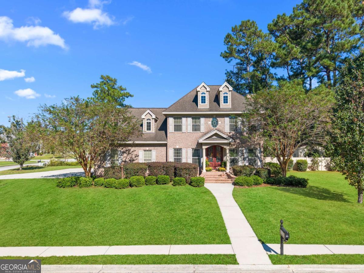 201 Walthour Drive Rincon, GA 31326 - Photo 28 of 29 a front view of a house with a yard