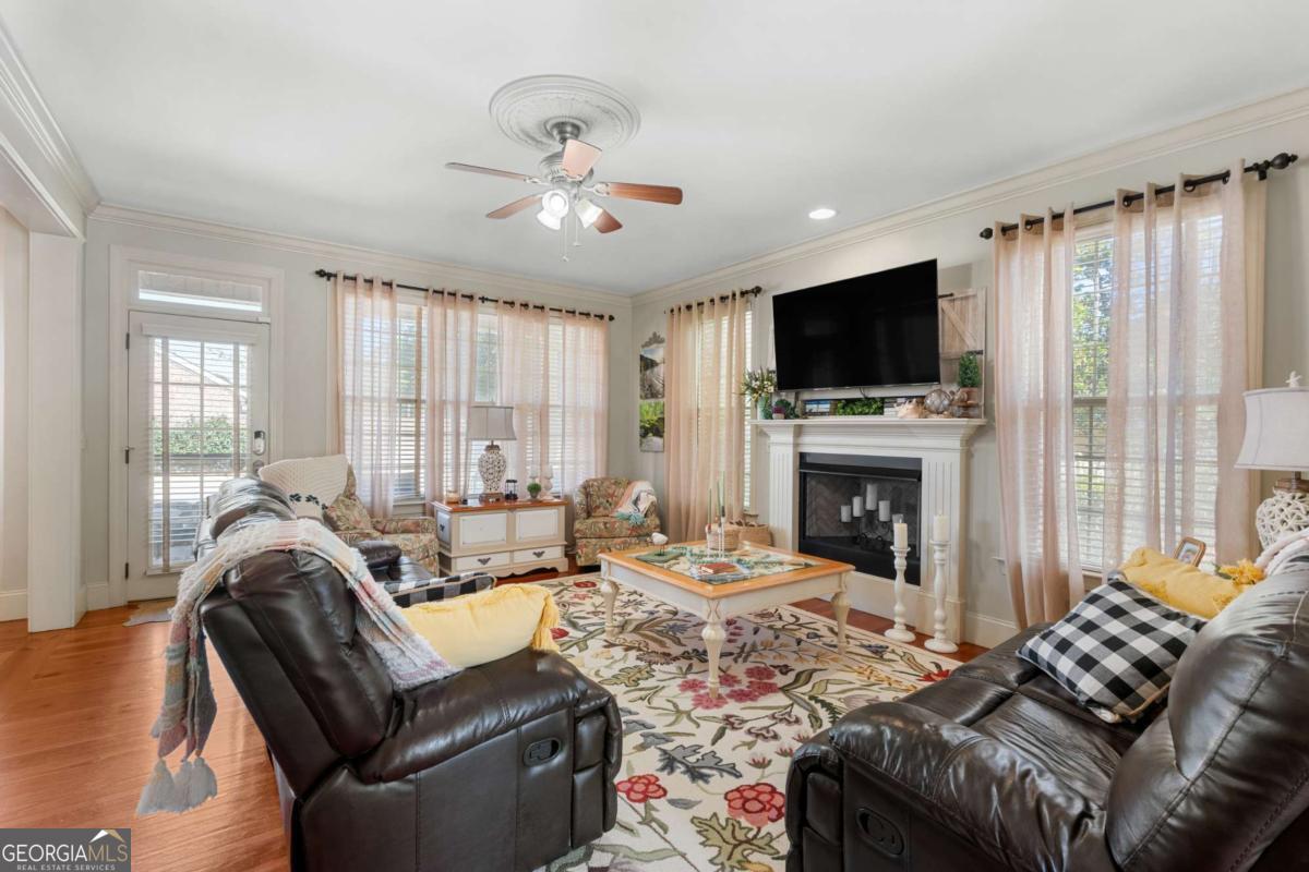 201 Walthour Drive Rincon, GA 31326 - Photo 5 of 29 a living room with furniture fireplace and flat screen tv