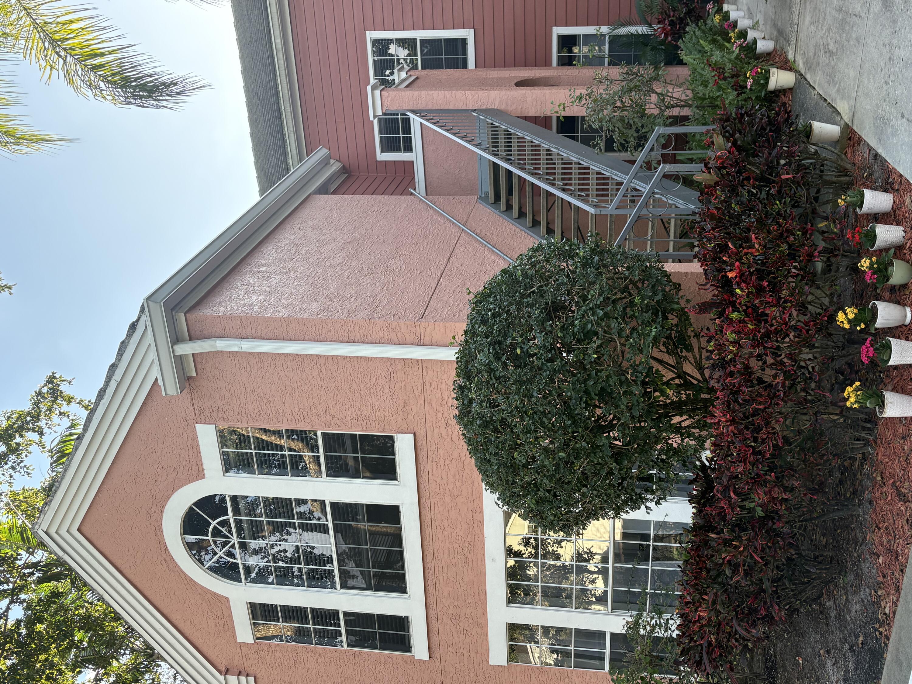 1001 Crystal Way, Unit A Delray Beach, FL 33444 - Photo 2 of 10 a front view of a house