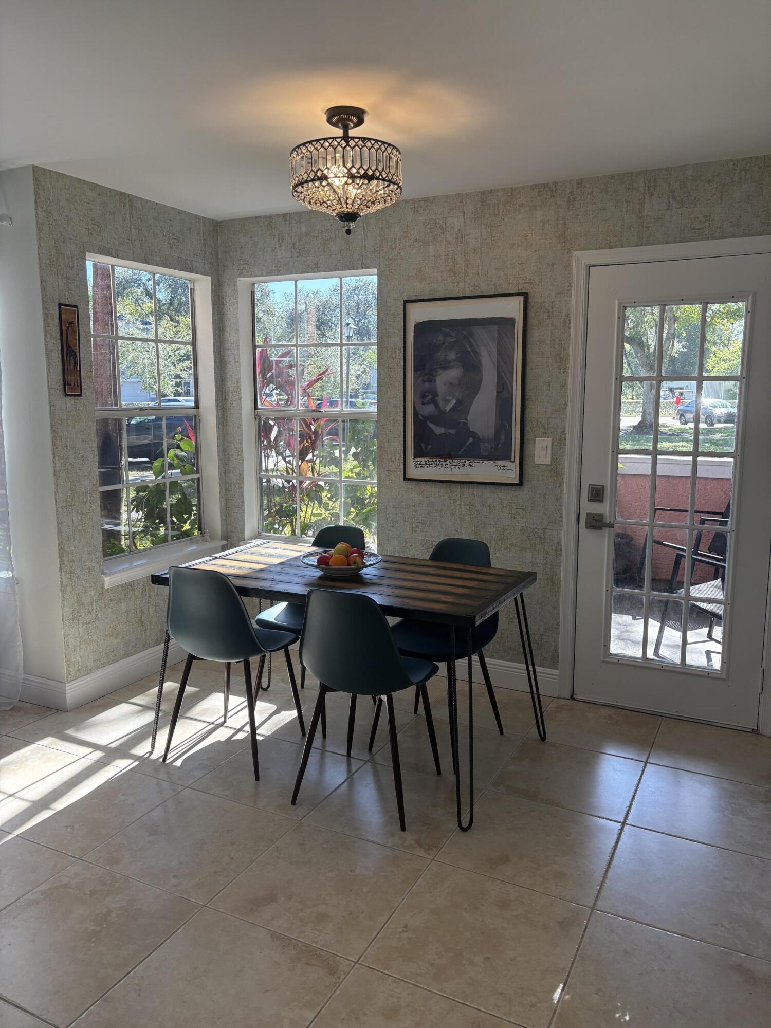 1001 Crystal Way, Unit A Delray Beach, FL 33444 - Photo 6 of 10 a work room with furniture and a window