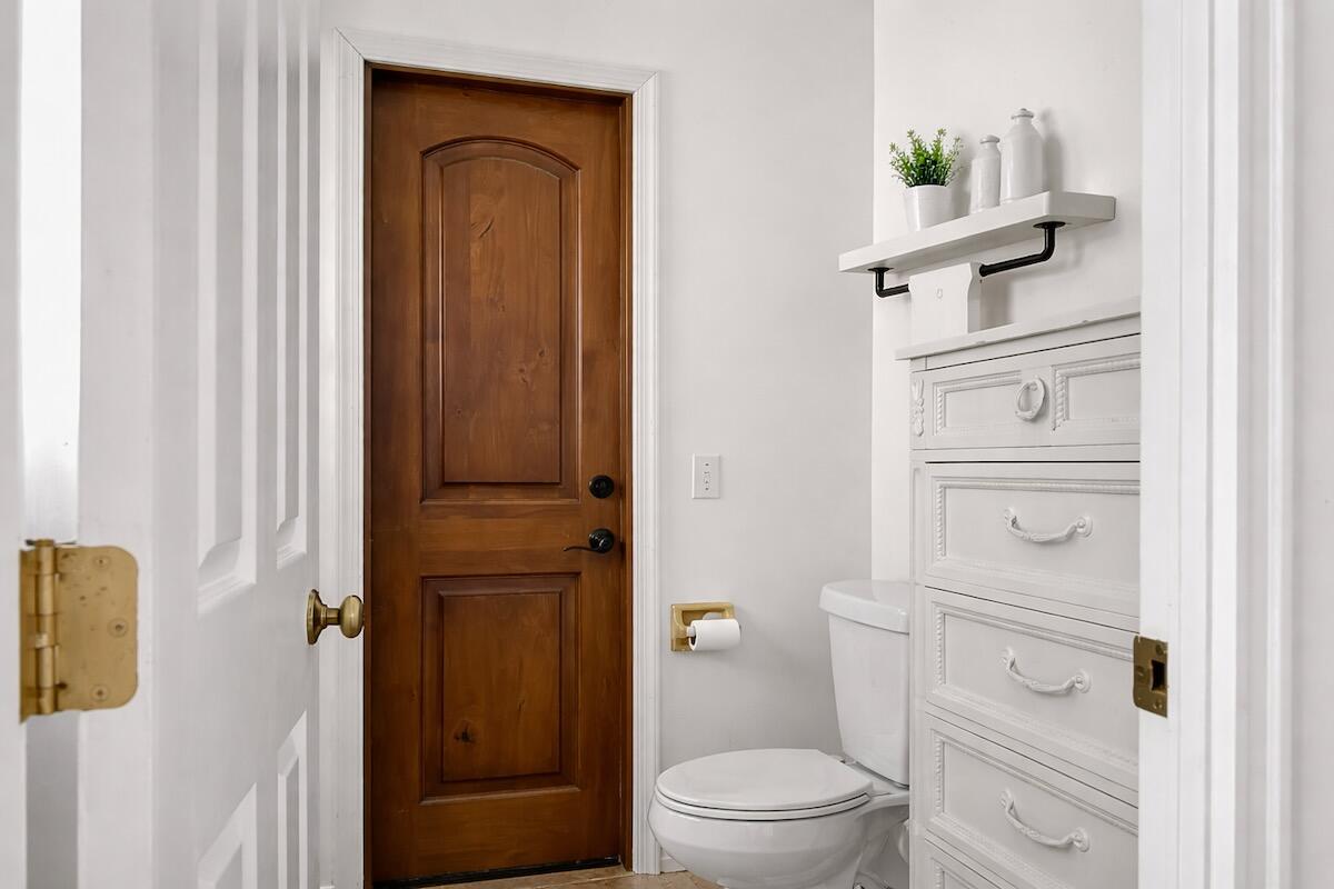 20952 Delagado Terrace Boca Raton, FL 33433 - Photo 15 of 27 a bathroom with a toilet a sink a vanity and mirror