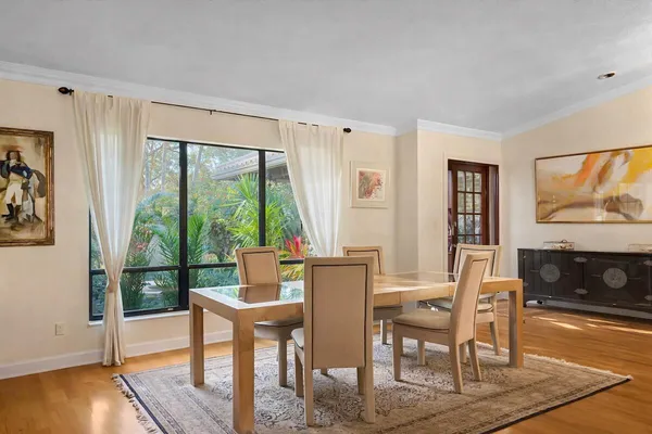 a view of a dining room with furniture window and outside view