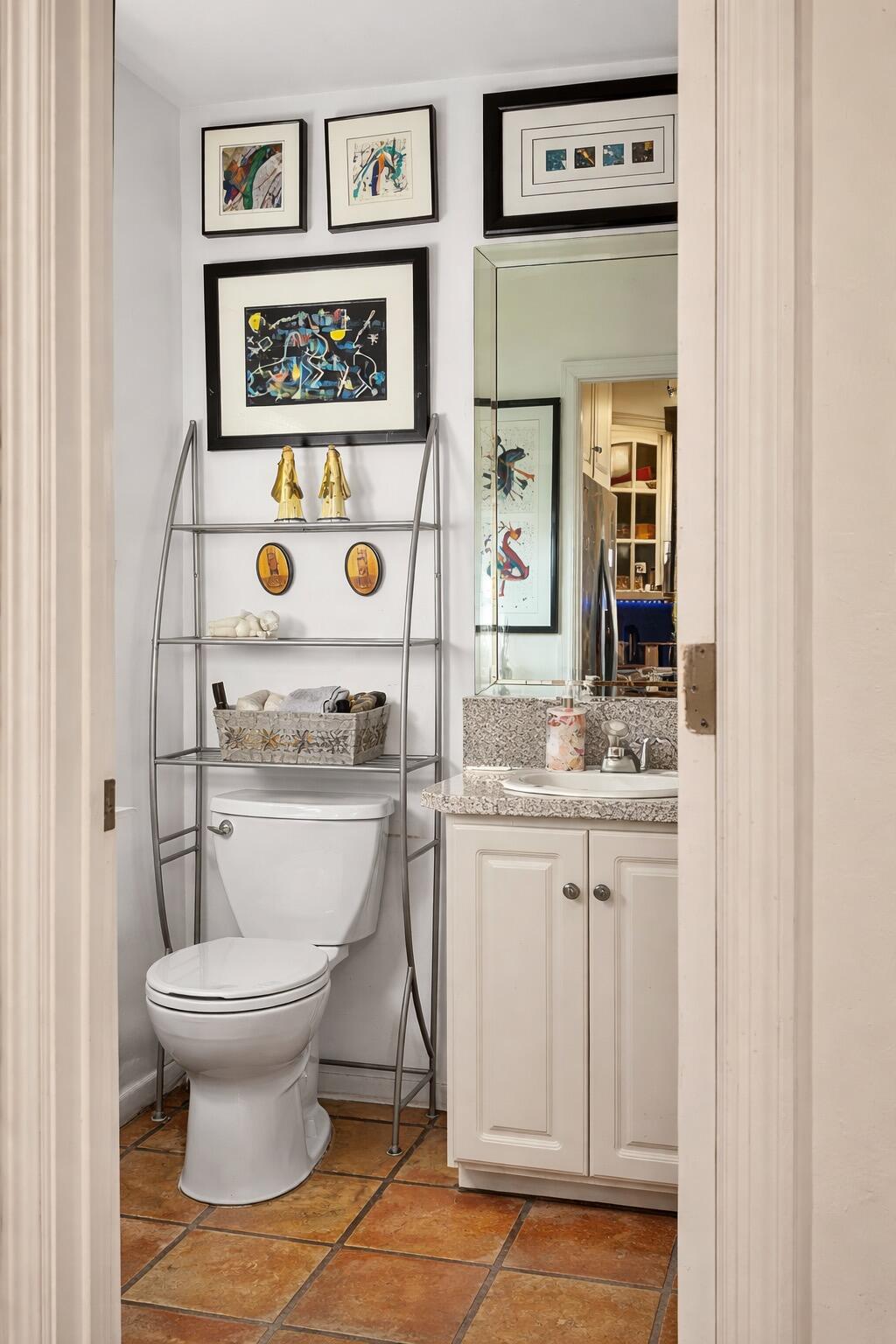 20952 Delagado Terrace Boca Raton, FL 33433 - Photo 8 of 27 a bathroom with a granite countertop toilet and a sink