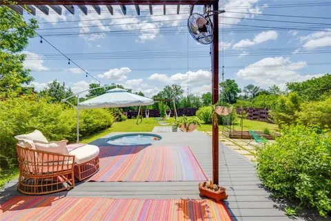 a view of a swimming pool with a patio