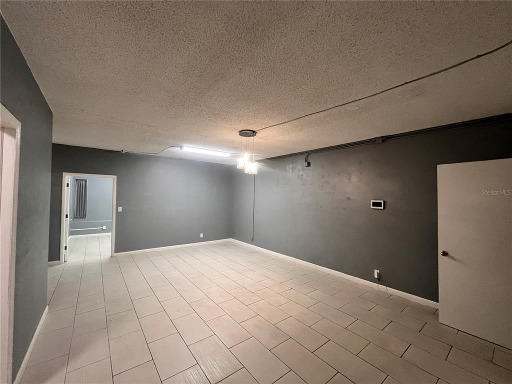 324 4th Street Northwest Winter Haven, FL 33881 - Photo 5 of 18 a view of a livingroom with an empty space