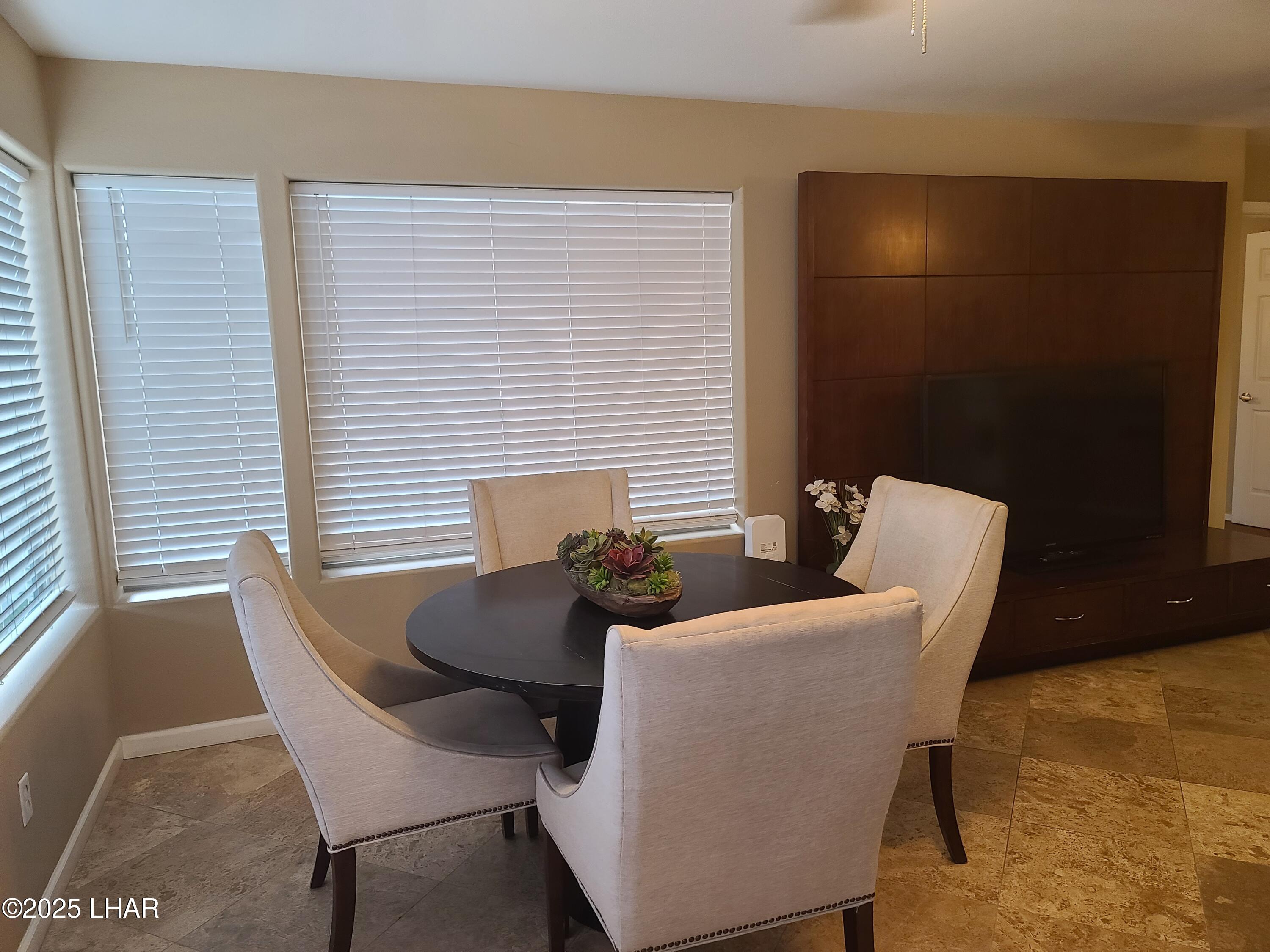 94 London Bridge Road, Unit 108 Lake Havasu City, AZ 86403 - Photo 16 of 38 a dining room with furniture and window
