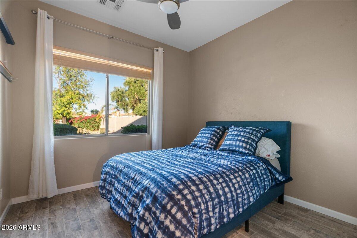 6427 South Magic Court Gilbert, AZ 85298 - Photo 17 of 71 a bedroom with a bed and window