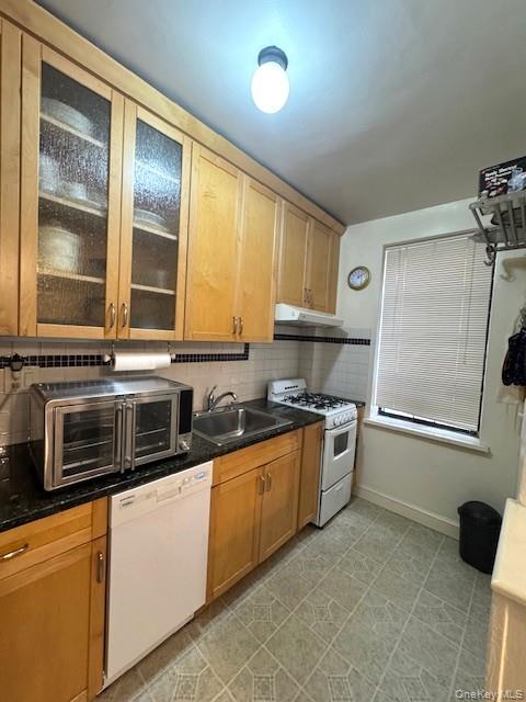 3600 Fieldston Road, Unit 4K Bronx, NY 10463 - Photo 5 of 10 a kitchen with stainless steel appliances granite countertop a stove and a sink