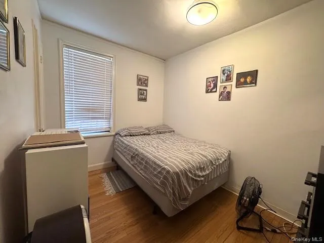 a bedroom with a bed and a desk