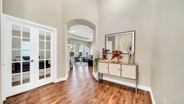 a view of a living room and dining room