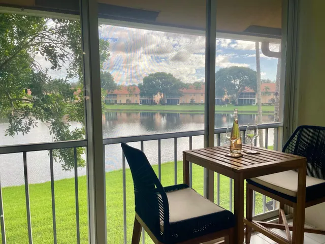 a view of a city from a dining room with large windows