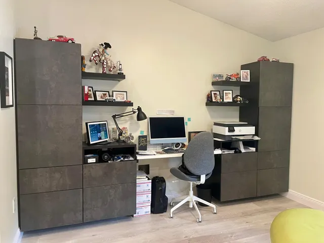 a work room with furniture and wooden floor