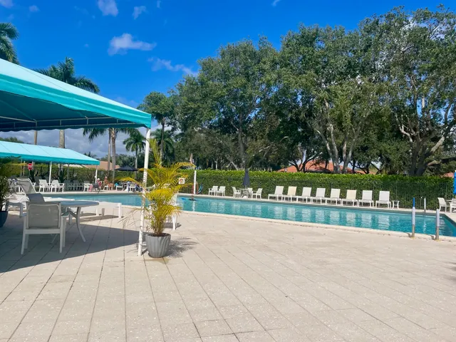 a view of swimming pool with outdoor seating