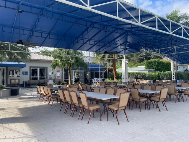 a view of an outdoor space with seating area and furniture