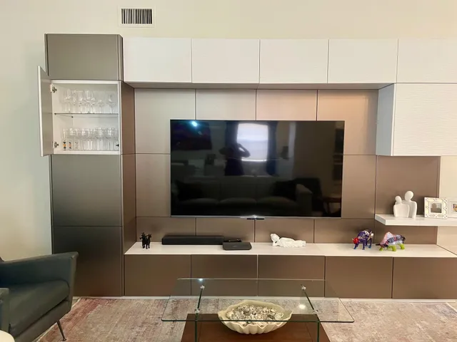 a living room with a fireplace and a flat screen tv