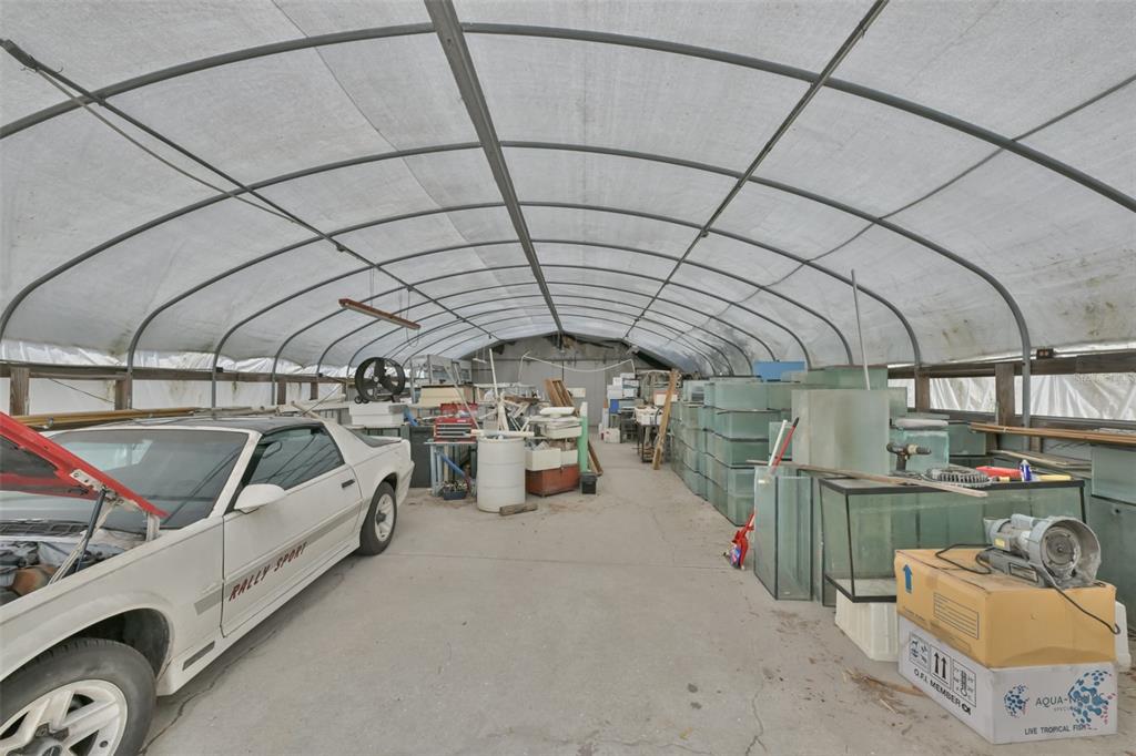 14451 Highland Road Wimauma, FL 33598 - Photo 21 of 80 a view of parking garage with cars