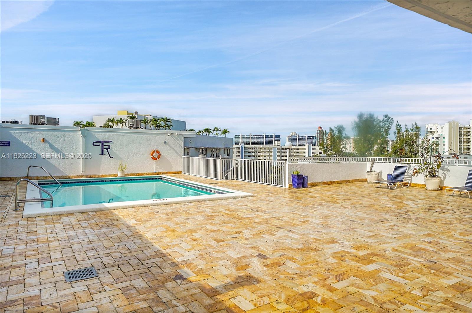 17800 Atlantic Boulevard, Unit 409 Sunny Isles Beach, FL 33160 - Photo 17 of 20 a view of a terrace with skyline